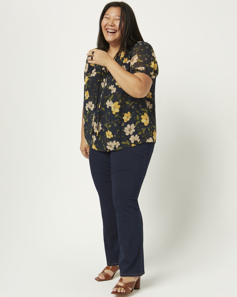 Front of a model wearing a size 16 Kairi Slim Bootcut Jean in Dark Wash by Meri Skye. | dia_product_style_image_id:216094